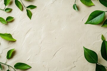 Poster - A minimalist textured surface made of recycled paper in natural beige tones is enhanced by scattered green leaves