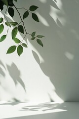 Poster - Soft shadows of green leaves gracefully cast onto a clean white wall create a fresh and modern aesthetic. The ample negative space invites creative text overlay in minimalist design