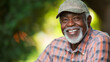 © InspirationDesign - Senior African American man smiling in casual outdoor setting. Great for retirement lifestyle, active aging, or joyful senior living.
