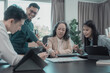 © ArLawKa - Group of business colleagues meeting in conference room Versatile modern office: leading business meetings with managers, talking, using graph presentations big data digital entrepreneur