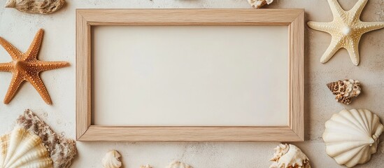 Poster - natural beech wood photo frame surrounded by seashells and starfish on a light marble background ide