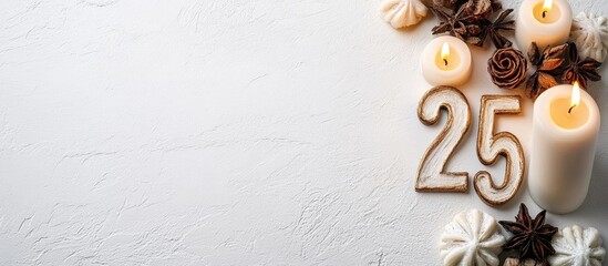 Fototapete - Festive arrangement featuring the number 25 in neutral tones with candles and decorative elements on a textured white background, ideal for seasonal celebrations.