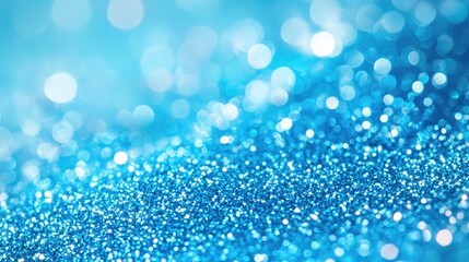Poster - elegant shimmering blue glitter texture on a soft light blue background with blurred bokeh effects c