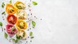 © Cyber Shutter - Colorful Assortment of Vegetable Dumplings in Pink Yellow and Red on White Background with Fresh Herbs Black Pepper and Empty Space for Text