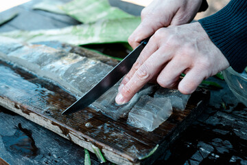 Wall Mural - man cutting some pieces of aloe gel