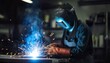 © Studio 100 - Welder working in a factory. Generated image