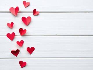 Poster - A Minimalist Design Features Small Red Paper Hearts Against A White Wooden Background, Ideal For A Postcard Or Love Message. 00003
