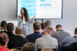 © Anton Gvozdikov - Female presenter engaging audience during business conference with focus on learning and networking. Professional setup promotes inspiration, idea exchange, career advancement, collaboration