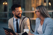 © Zamrznuti tonovi - Business people having fun using digital tablet outdoors after work