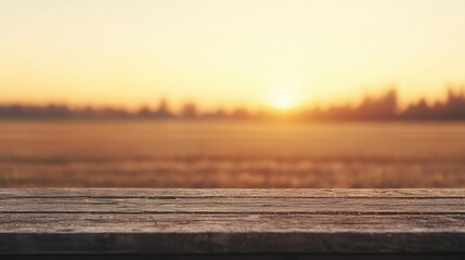 Poster - Wooden table showing a blurred rural landscape at sunset