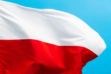 Wall Mural - Poland flag waving on blue background