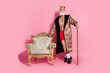 © deagreez - Photo of funny arrogant man poker gamer wear traditional king costume isolated on pink color background