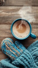 Fototapete - A serene winter flat-lay captures a steaming cup of coffee beside a pair of cozy knitted mittens, evoking warmth and comfort against a rustic wooden background