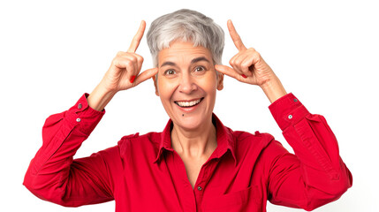 Wall Mural - Joyful mature woman in a red shirt, pointing at her temples with both index fingers