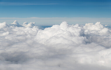 Wall Mural - looking at the clouds and sky on the plane