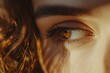 © Alena - Close-up view of a woman's eye with long brown hair, ideal for use in portraits or beauty-related content