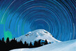 © Adobe - A majestic, snow-capped mountain peak rises dramatically against a vast, starry night sky.