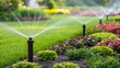 © DigitalSpace - A medium closeup of a lush garden with several newly installed sprinklers poised to water different plant beds highlighting their strategic placements.