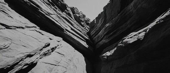 Poster - Striking layered rock formation displaying distinct strata and varied textures in natural sunlight