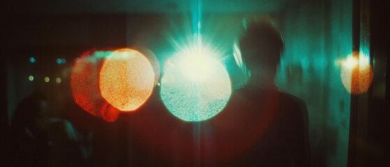 Poster - Lens flare and circular bokeh create an ethereal atmosphere with blurred lights in the background