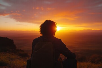 Poster - Traveler enjoys the beauty of a breathtaking sunset while sitting on a hillside overlooking the valley. Generative AI