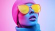 © Irina Kozel - A vibrant studio portrait of a mannequin wearing oversized yellow sunglasses and a pink beanie against a gradient blue and pink background