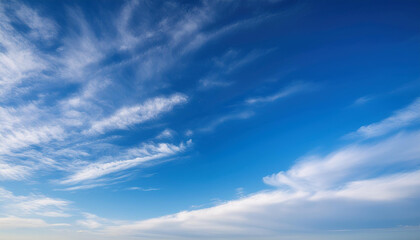 Wall Mural - a serene blue sky filled with wispy white clouds creating a peaceful and uplifting atmosphere