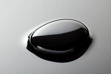 Aufkleber - Close up view of a glossy black oil drop showcasing its smooth texture and curvature in bright light. Generative AI