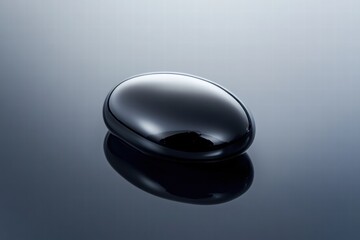Leinwandbilder - Close up view of a single black oil drop reflecting light on a smooth surface. Generative AI