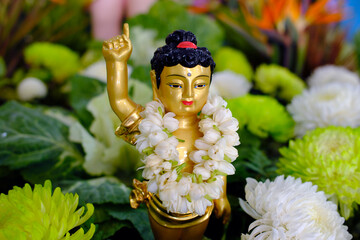 Wall Mural - Thien Quang buddhist pagoda.  Infant Buddha statue pointing the north. On Vesak Day, Buddhists  commemorates: the birth, enlightenment and the death of Buddha Gautama. Tan Chau. Vietnam.