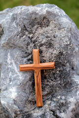 Wall Mural - Close-up of a Christian cross on a rock. Symbol of eternity. .