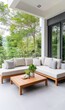 © khonkangrua - Modern Outdoor Lounge Area with Cozy Sectional Sofa and Natural Greenery Surrounding the Space