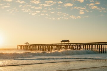 Wall Mural - A pier over the Atlantic Ocean at sunrise in Fernandina Beach, Florida