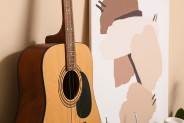 Wall Mural - Modern acoustic guitar in stylish living room, closeup