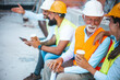 © Dragana Gordic - Team of Construction Workers Having a Friendly Break on a Jobsite