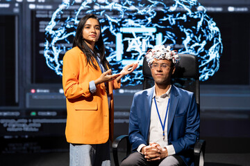Poster - speaker does eeg headset presentation during tech convention, demonstrating successful implementatio