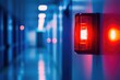 © redflower - Close-up of a bright red emergency alert light in a hallway.