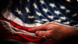 © Caroline - hand resting on United States flag american red white blue stripes and stars patriotic abstract honor reverence elegant abstract macro close-up background