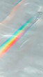 © Siasart Stock - Rainbow light reflection creates a vibrant spectrum on a smooth surface, perfect for backgrounds.