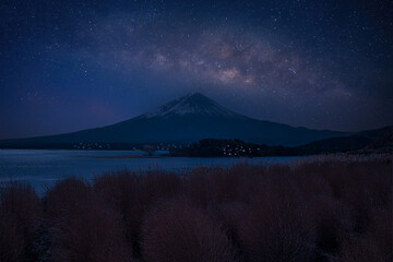 Wall Mural - universe space and milky way galaxy with stars on night sky mt fuji background. milky way galaxy mt 
