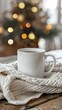 © Jee Pong - Cozy Coffee Mug with Steam on Knit Blanket Near Christmas Tree