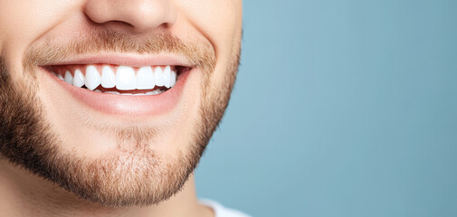 Wall Mural - close up of smiling man showcasing bright, white teeth and well groomed beard against soft blue background, conveying confidence and happiness