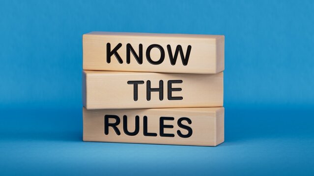 Know the rules symbol. Wooden blocks with words Know the rules.Business and Know the rules concept. Copy space.3D rendering on blue background.