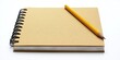 © ShStock - Yellow spiral notebook with blank pages positioned on the left and a sharpened yellow pencil resting diagonally on top against a white background