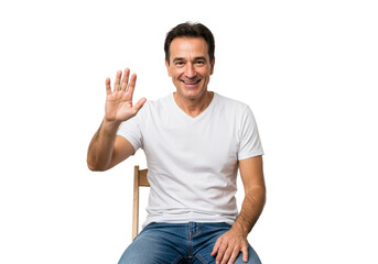 Sticker - Smiling Man Waving Hand Happy Gesture Friendly White TShirt Jeans Casual Sitting male model adult   