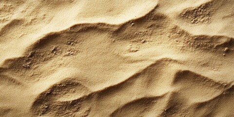 Poster - Sand texture in warm beige tones with gentle waves and soft shadows against a light brown background, offering ample space for text or design.