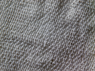 Fototapete - A close up of a white fabric with a pattern of white threads
