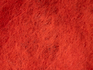 Poster - A close up of a red fabric with a fuzzy texture