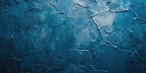 Wall Mural - Textured deep blue wall surface with uneven patterns positioned centrally in a fullframe background ideal for creative design projects