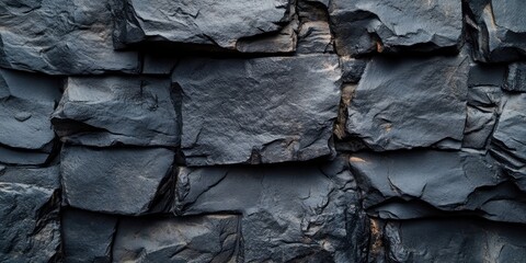 Poster - Textured dark gray slate stone wall background with layered rock placements for creative design projects and modern architectural themes